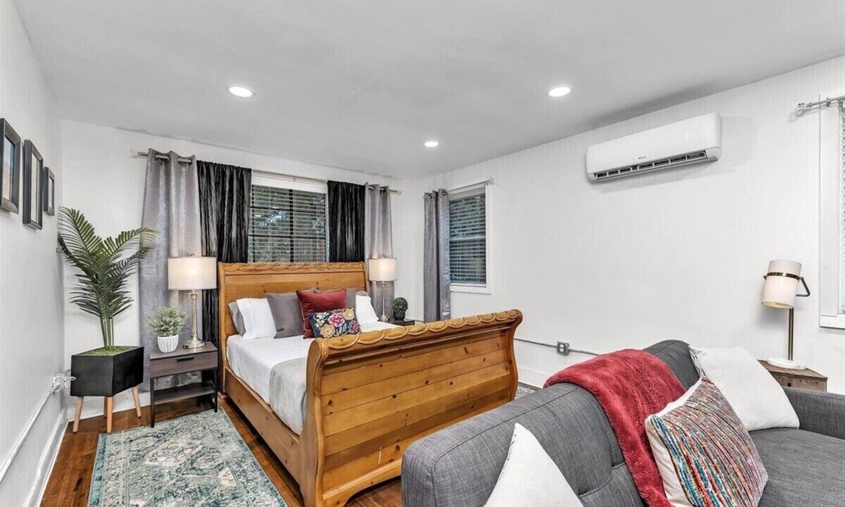 Summerville House | 1 bed 1 bath home that sleeps max 4 guests with sleeping arrangements being a queen bed and a fold out couch that is queen sized.