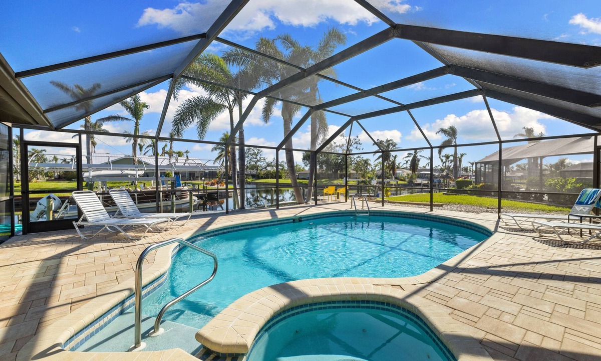 Yacht Club House | 5 Bedroom/4 Bath Saltwater Pool Home with Kayaks and Boat! Fishing off the dock!