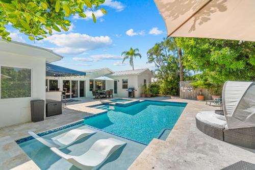 Singer Island House | Across from Beach- 3 Master Suites, Heated Pool & Spa, Tanning Ledge, Golden Tee - by Maven Vacation Rentals