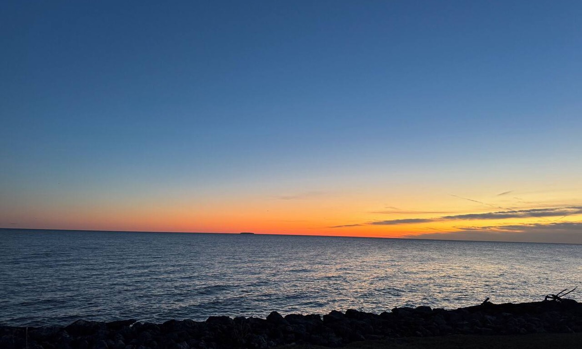 Curtice House | Awesome Sunrise from our peaceful waterfront 3 bed- 2.5 bath home, with Tiki Bar