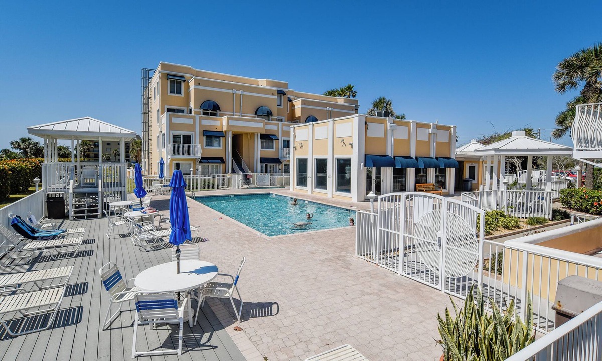 Cape Caneveral Beach Gardens Condo | Bright corner condo with shared pool, beach access, free WiFi & washer/dryer