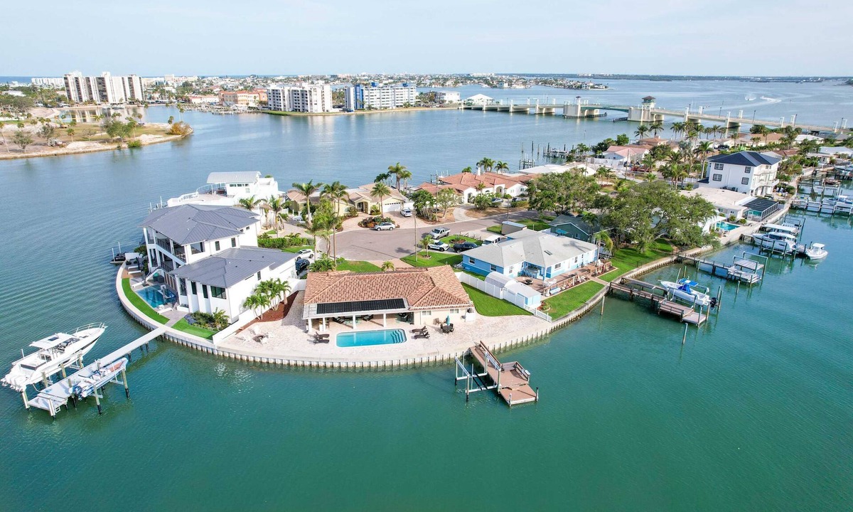 Causeway Isles House | Chic waterfront retreat with private pool and outdoor kitchen near the beach