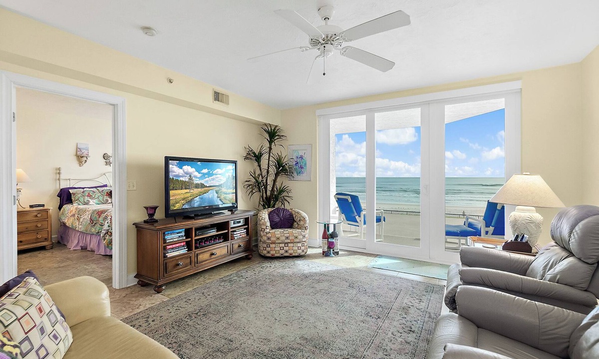 Ponce Inlet Condo | Enjoy this beachfront 2BR condo in Ponce Inlet with a ground-level patio offering direct access to pool and beach. Features a heated pool, fitness room, and clubhouse. Master has a king bed with private bath; guest room includes a king and two twins