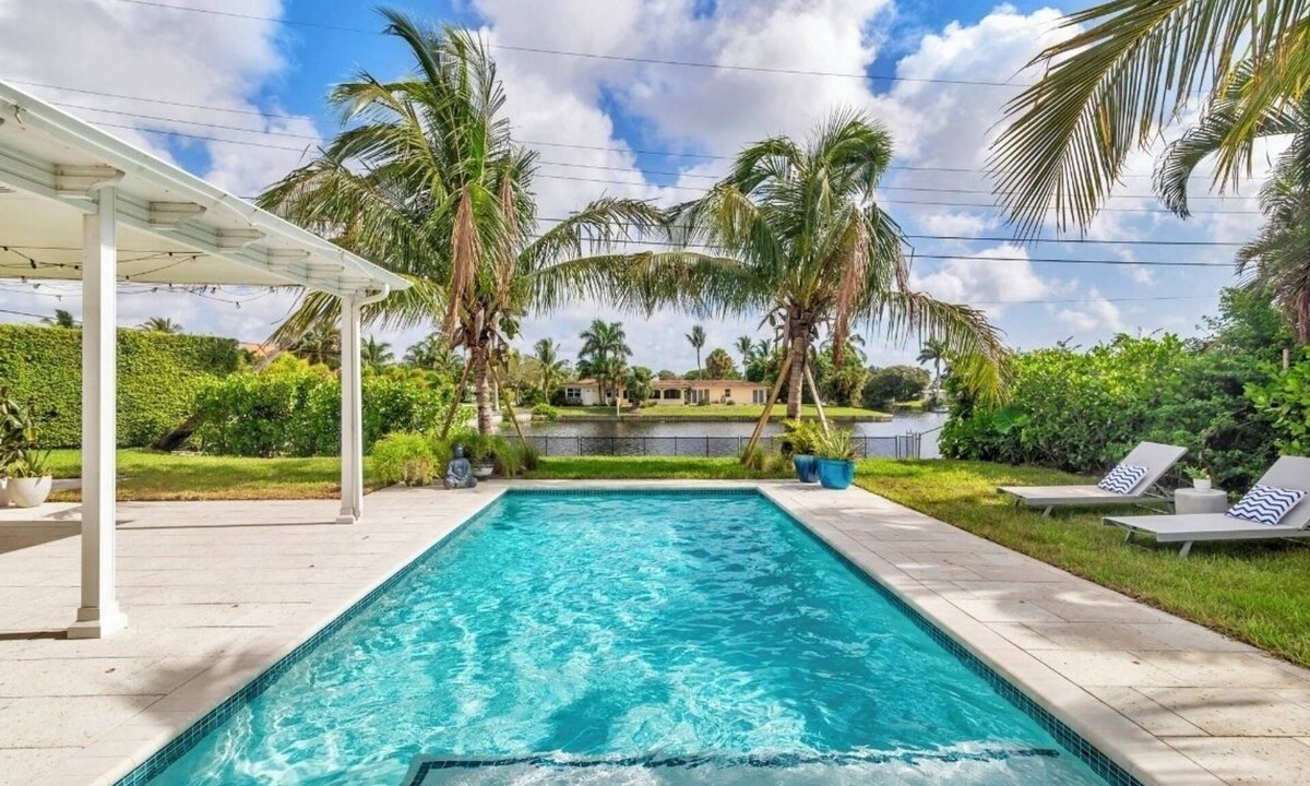 Lake Clarke Shores House | Fully upgraded waterfront pool home, centrally located in West Palm Beach!