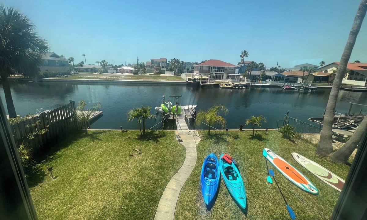 Spring Hill House | Little Stilt House with Boat dock