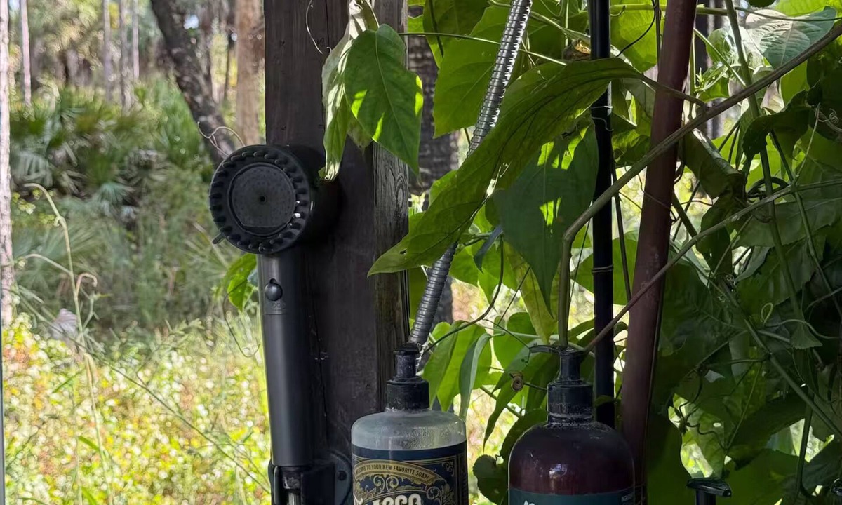 Rural Estates Cabin | Luxury off-grid passionfruit covered shipping container immersed in nature.