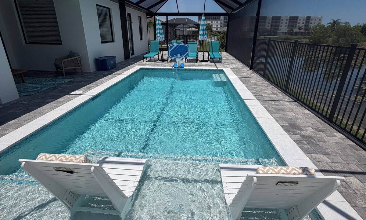 Trafalgar House | Newly Built Modern Vacation Home 4 BR/3 BA Your Own Heated Pool, Lanai on Canal