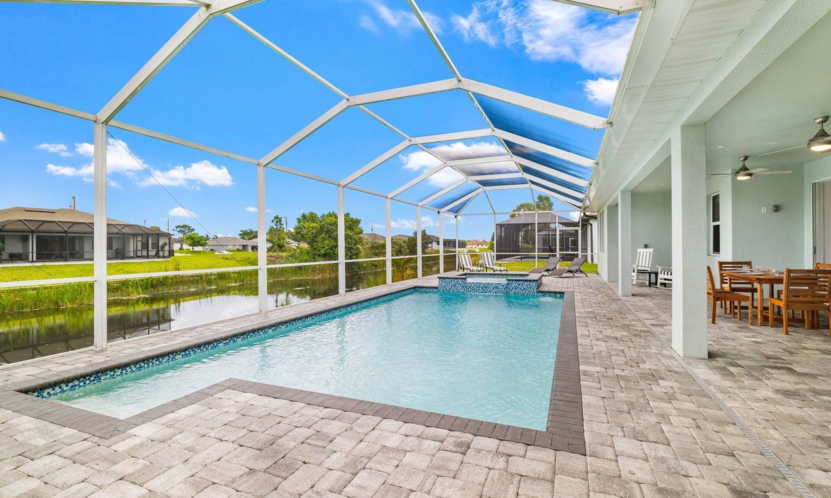 Mariner House | Relax & Unwind: Canal-Front Escape with Pool, Hot Tub & Lanai