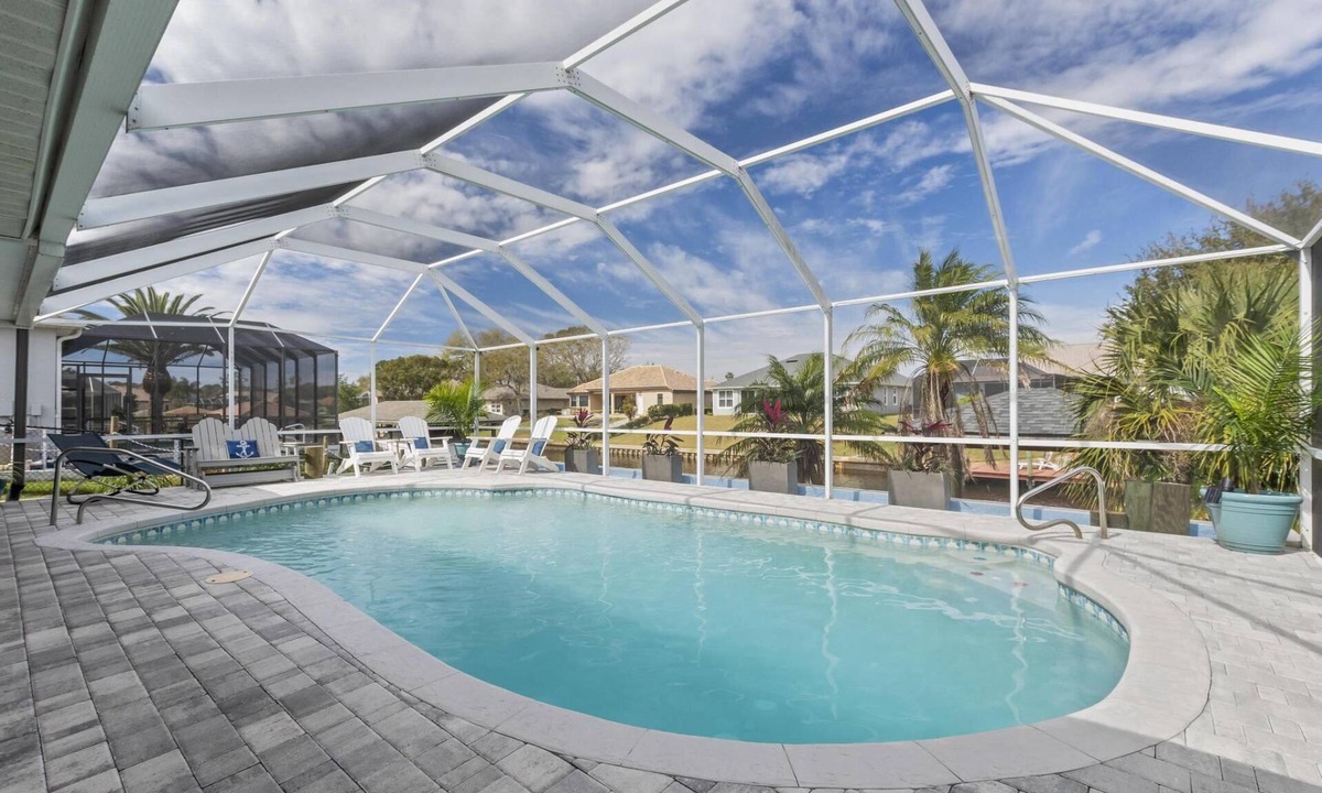 Palm Harbor House | Sea Stone Waterfront Pool Home | Boat Dock | Close to Golf | Heated Pool | Dog Friendly