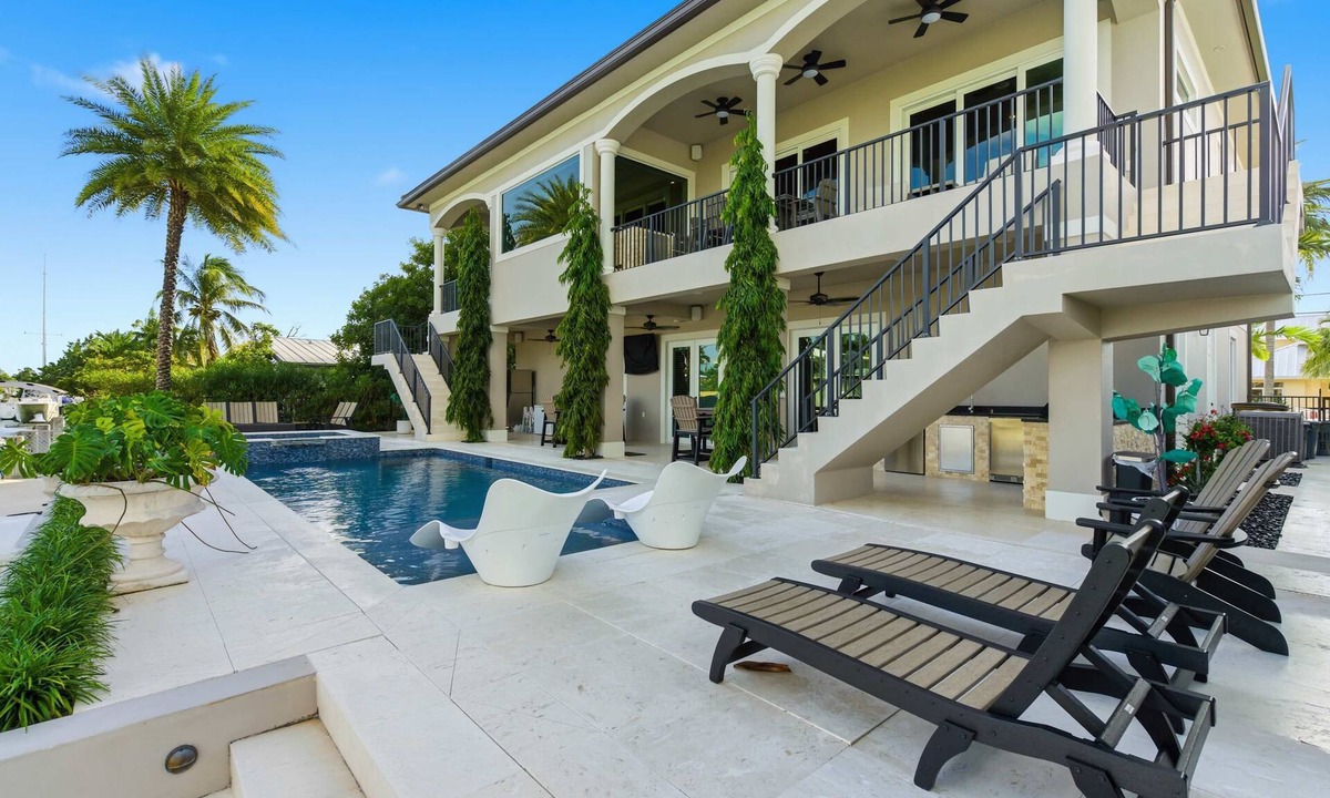Key Colony Beach House | Southern Palms -Luxury 5 Bd/6 Bath waterfront home on wide canal in Key Colony Beach, private pool and hot tub, 32' Dockage, Minutes to Atlantic Ocean, Easy Access.Newer Construction. Ice Maker, All Bedrooms with Ensuite Bathrooms, Stunning water views