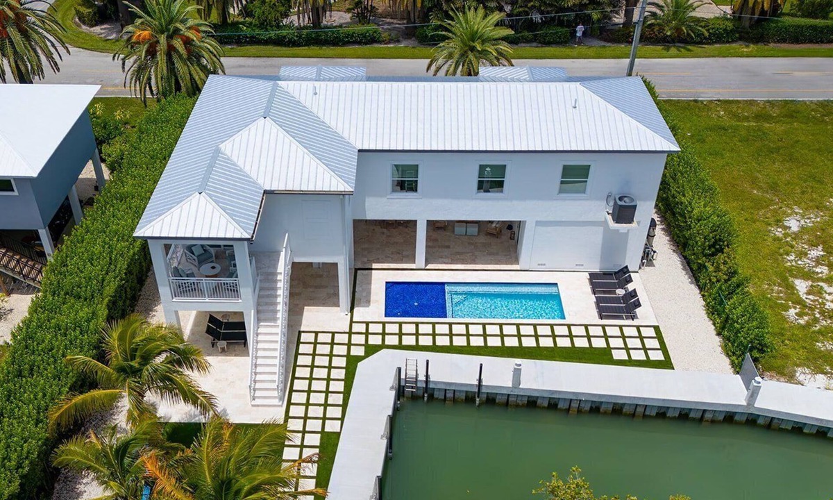 Coury House | Sunshine Getaway in Kcb Luxury Pool Home, 3BR · 3BA · Heated Pool · Bikes · Foosball · Outdoor TV · Pet-Friendly