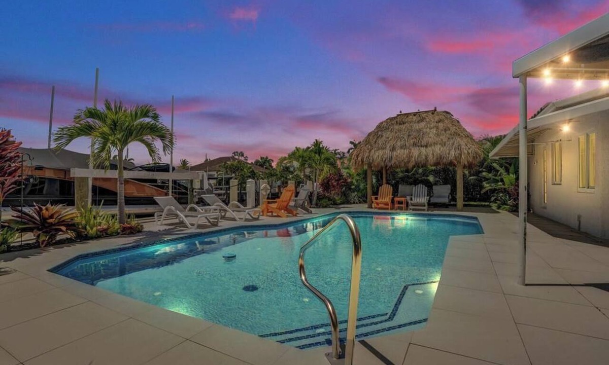 Garden Isles House | Tropical vacation retreat! Waterfront and Heated pool!