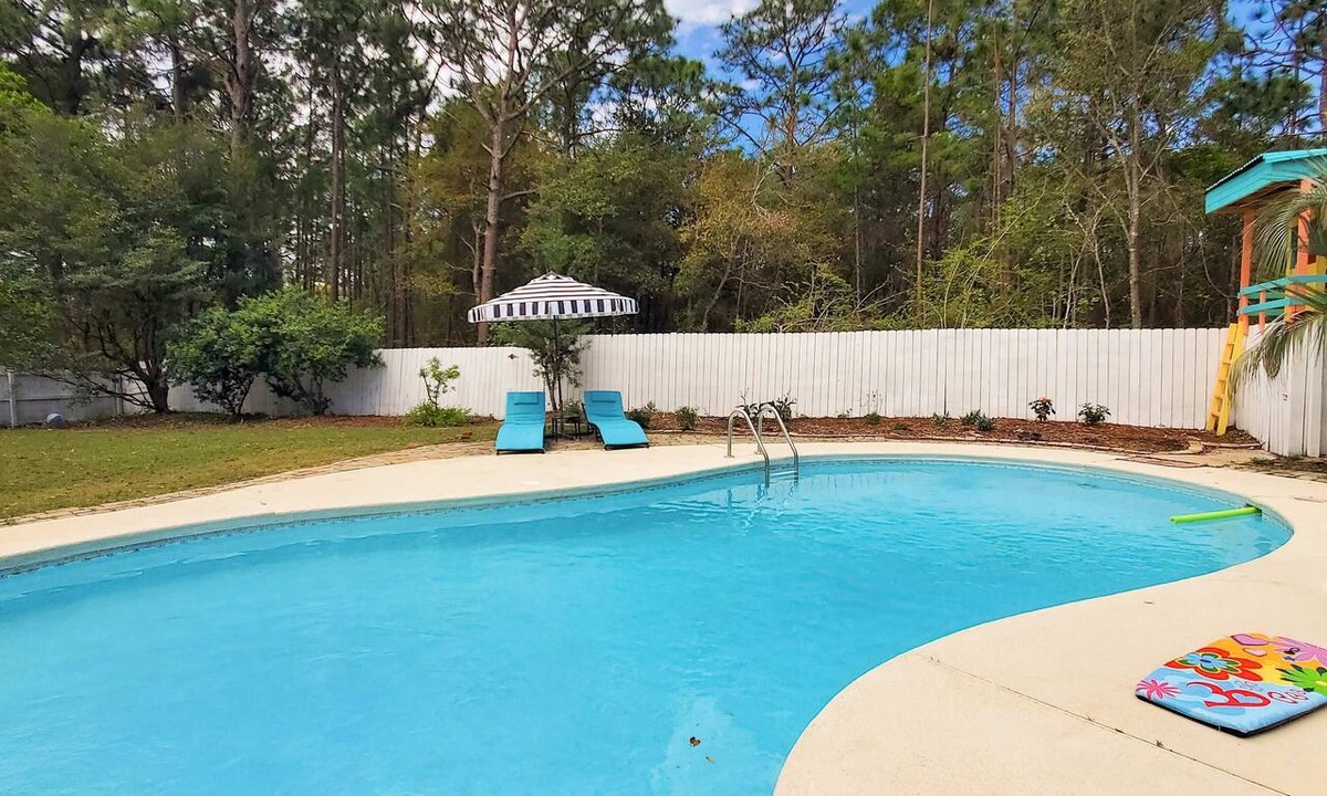 Navarre House | Updated dog-friendly home with private outdoor pool, patio, fireplace, W/D, AC