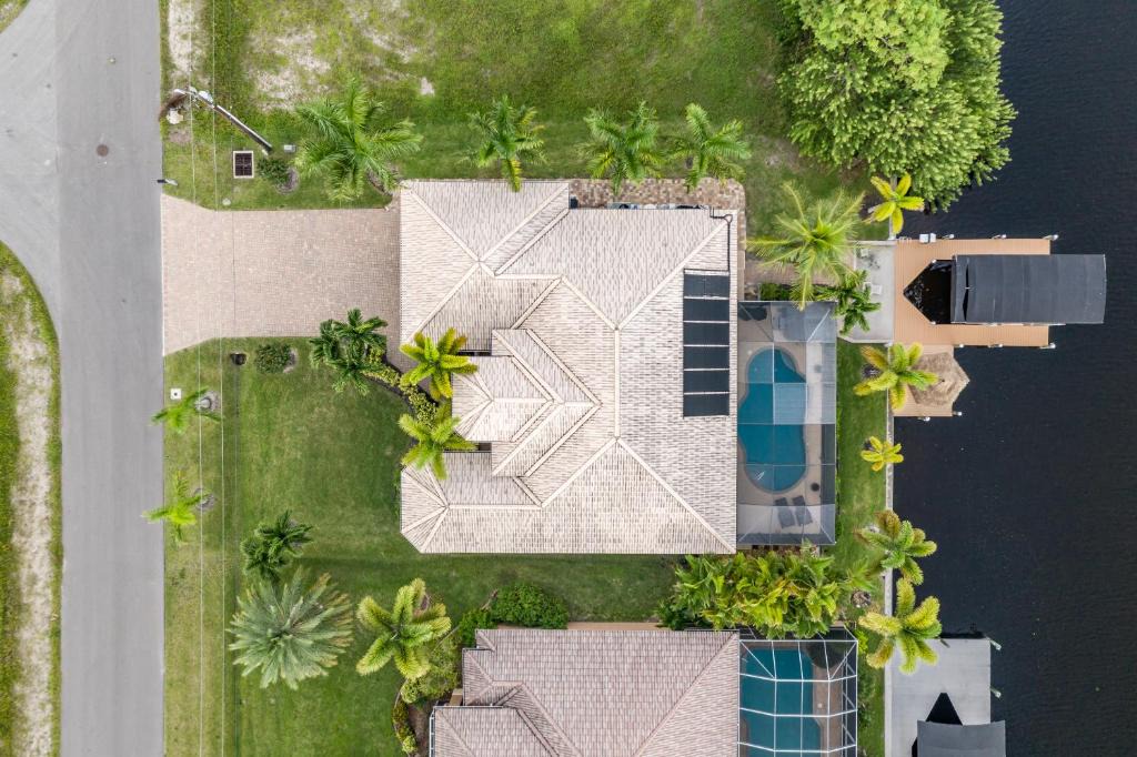 Burnt Store House | Villa Neptune's Grotto- BRAND NEW with heated Pool, Hot Tub, and dock with Tiki