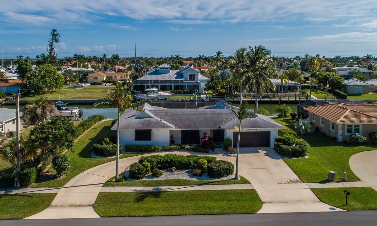 Marco Island House | Waterfront 3BR retreat with heated pool, WiFi, and marina access.