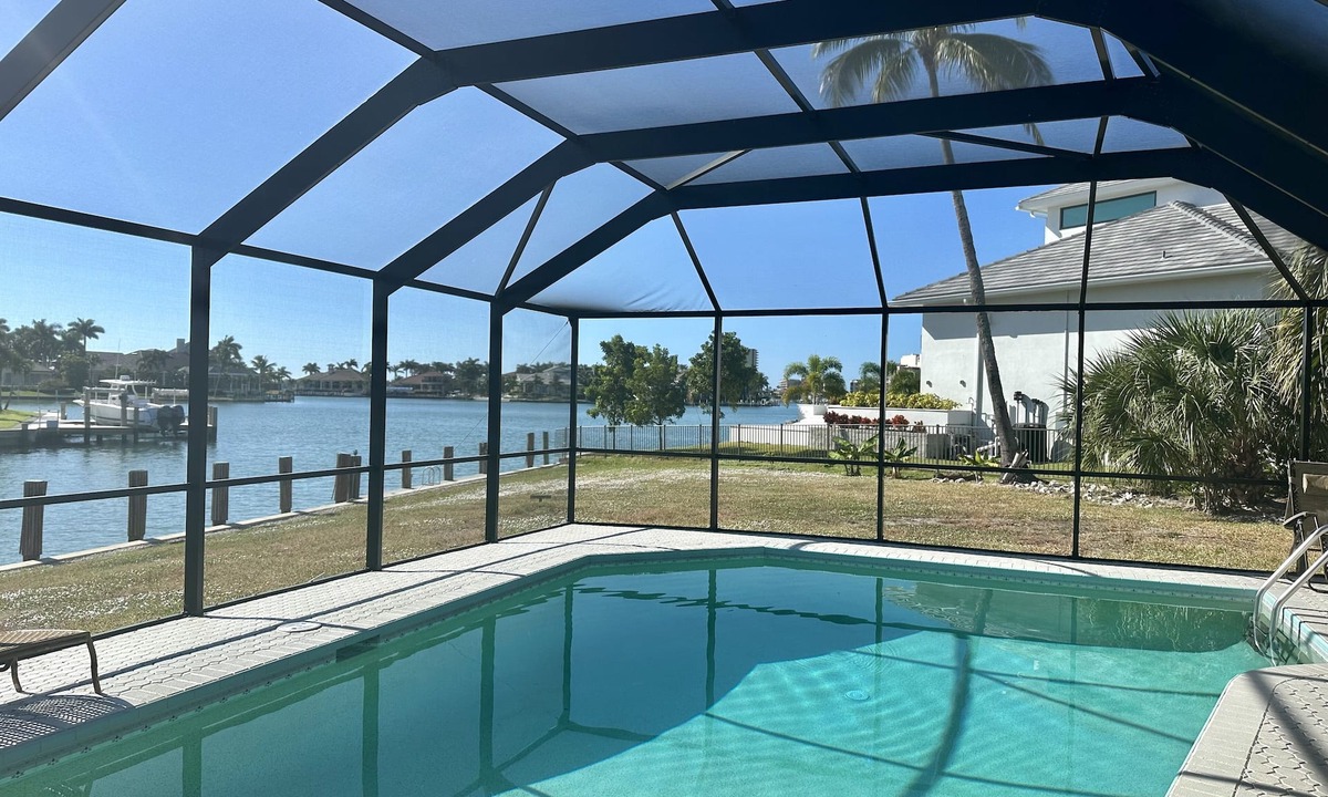 Marco Island House | Waterfront home with south facing pool & views over the bay