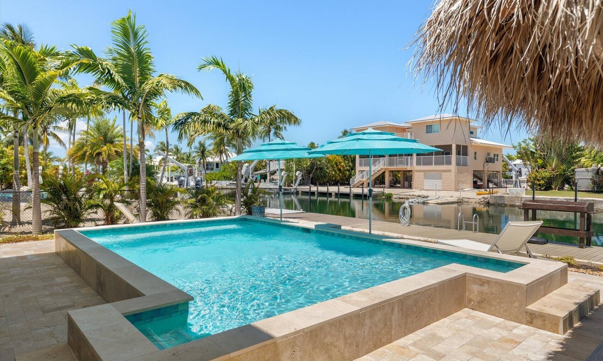 Sugarloaf Shores House | Waterfront Pool Home w/100' Dock, Tiki Hut & Boating Access Near Key West