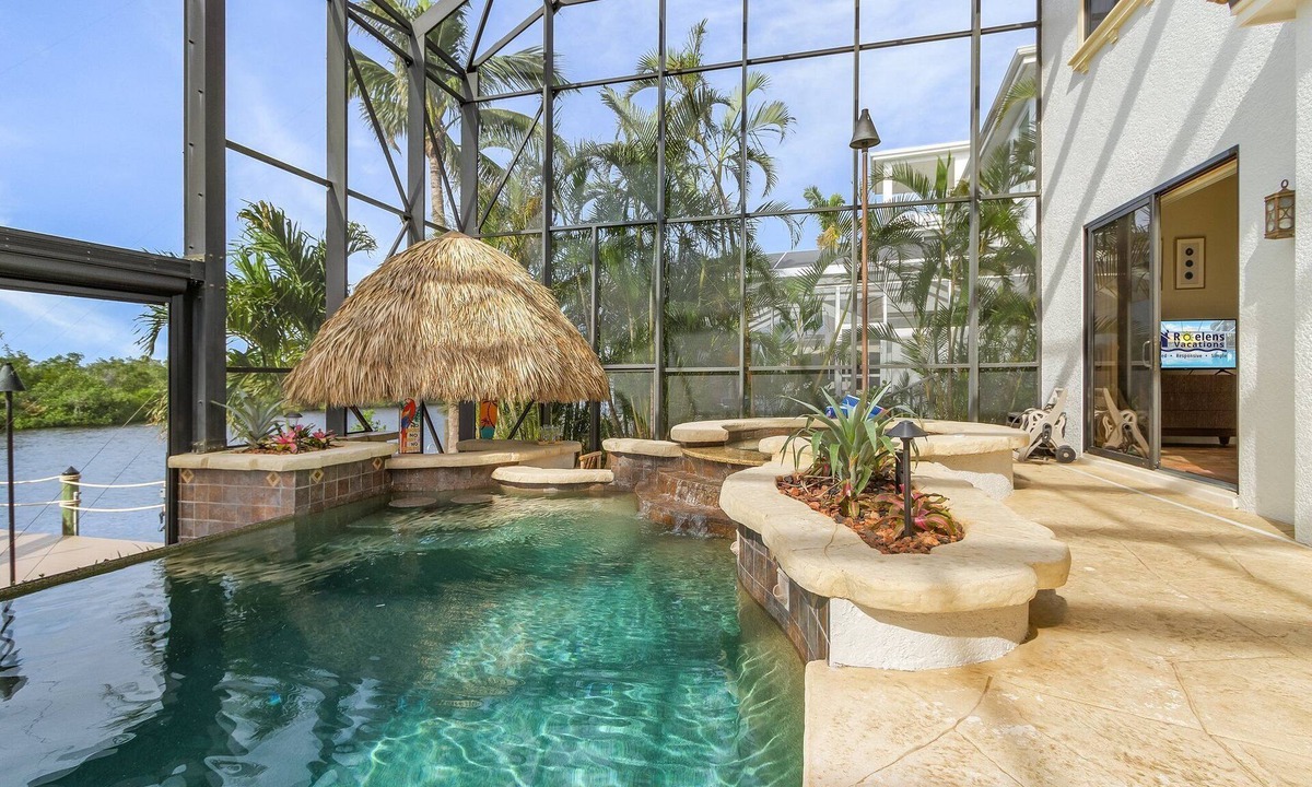 Pelican House | WOW! Experience Luxury! Gulf Access, Pool & Spa, Kayaks, Dock, Tiki- Villa Waterfront Wonderland