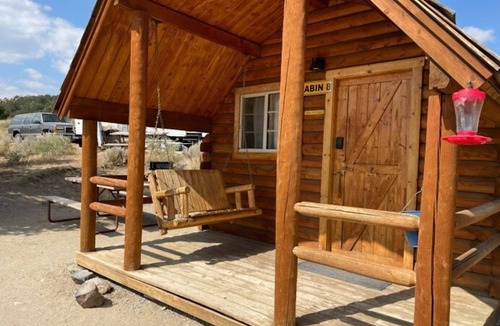 Buena Vista Cabin | 1 Room Dry Camping Cabin. Sleeps up to 4 in one queen bed and a set of twin bunks (bunk bed linens provided upon request).