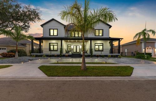 Golf and Sea Village of Apollo Beach House | 2 Million Villa Heated Pool w Luxury Spa 6BR & 6BR Waterfront by Canal