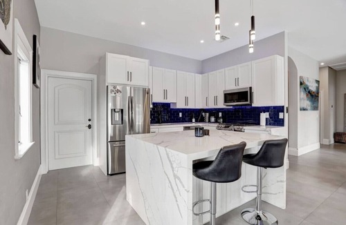 South New River Isles House | 3BR Waterfront Villa with Heated Pool, Spa, & Rooftop Deck