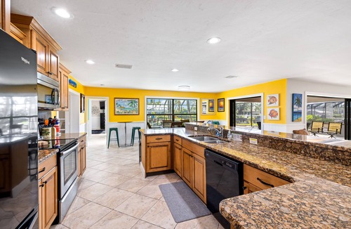 Yacht Club House | 5 Bedroom/4 Bath Saltwater Pool Home with Kayaks and Boat! Fishing off the dock!