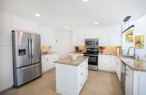 Lighthouse Point House | A Tropical paradise backyard pool, family friendly, Boat lift and Dock