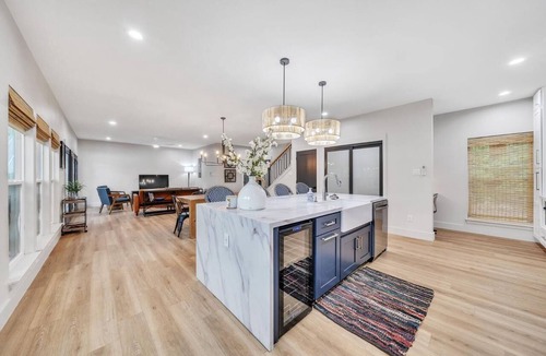 New Braunfels House | A unique Guadalupe River retreat featuring two stylish homes, private river access, a cozy fire pit, and a fun-filled game room—perfect for families, friends, and group getaways.