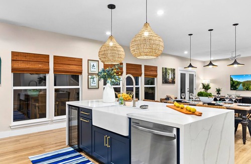New Braunfels House | A unique Guadalupe River retreat featuring two stylish homes, private river access, a cozy fire pit, and a fun-filled game room—perfect for families, friends, and group getaways.