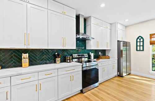 New Braunfels House | A unique Guadalupe River retreat featuring two stylish homes, private river access, a cozy fire pit, and a fun-filled game room—perfect for families, friends, and group getaways.