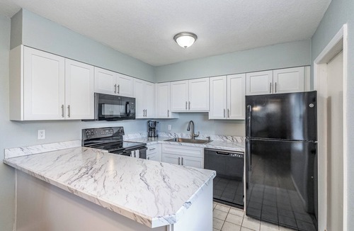 Port Canaveral Condo | Affordable 2BR Main floor unit RIGHT ON THE BEACH! 1 King & 2 Queen Beds!