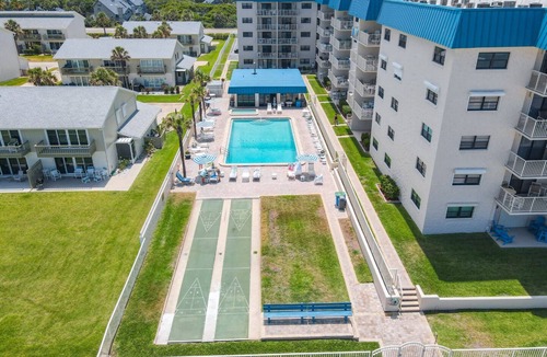 New Smyrna Beach Condo | Beachfront Corner unit overlooking pool | Walk to shopping and dining | HA501
