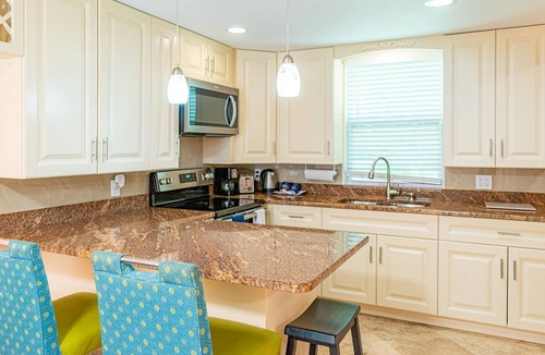 Indian Shores Condo | Beautiful condo across the street from the beach. Pet/kids friendly