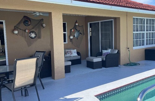 Burnt Store Isles House | Beautifully remodeled three bedroom two bath waterfront property with pool.