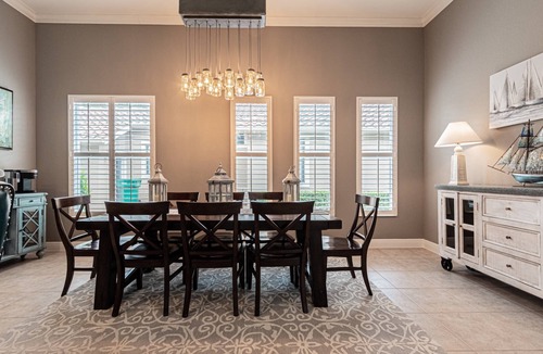 Central Naples House | Briarwood Upscale home with two primary suite-heated pool & spa- entertaining area w/TV