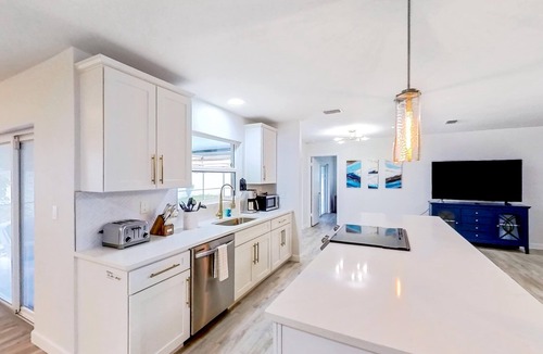 Dunedin House | Bright and open home with private pool screened lanai enclosed yard and WD