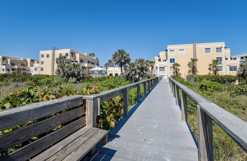 Cape Caneveral Beach Gardens Condo | Bright corner condo with shared pool, beach access, free WiFi & washer/dryer