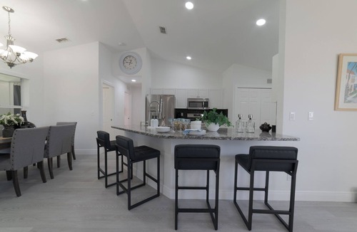 Trafalgar House | Bright & Modern Cape Coral Home · 3BR · Sleeps 8 · BBQ · Beach Gear