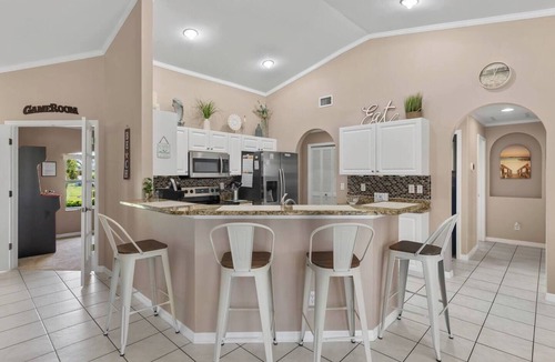 Trafalgar House | Cape Coral Canalfront Oasis: Private Dock, Heated Pool & Arcade Fun