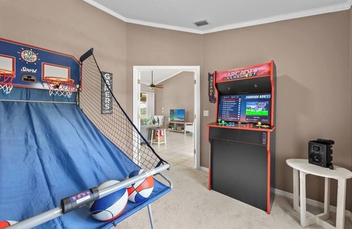 Trafalgar House | Cape Coral Canalfront Oasis: Private Dock, Heated Pool & Arcade Fun