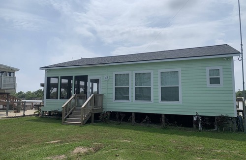 Matagorda Cottage | Comfortable Two Bedroom on the river, WIFI, Lighted Pier with beautiful sunsets!