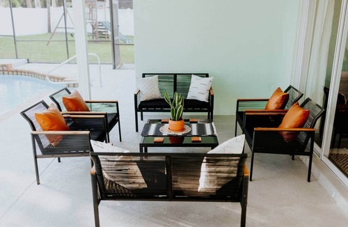 Palma Sola House | COQUINA HAUS stylish home steps away from private Bay inlet!