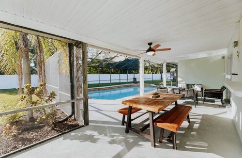 Palma Sola House | COQUINA HAUS stylish home steps away from private Bay inlet!