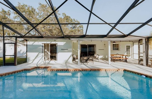 Palma Sola House | COQUINA HAUS stylish home steps away from private Bay inlet!