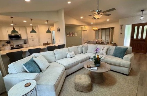 Gulf Cove House | Cozy and private waterfront retreat with hot tub, grill, deck, and firepit!