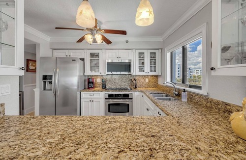 New Smyrna Beach Condo | Direct oceanfront corner 3/2 with a large wrap around balcony and heated pool