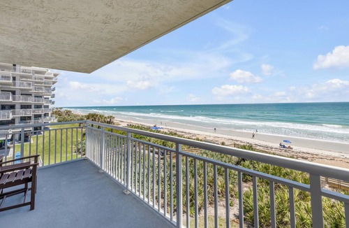New Smyrna Beach Condo | Direct oceanfront corner 3/2 with a large wrap around balcony and heated pool