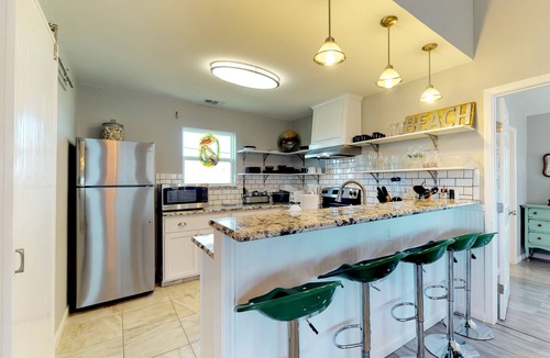 Bermuda Beach Cottage | Dog-friendly cottage with two primary suites, ocean views, beach access, & deck