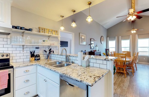 Bermuda Beach Cottage | Dog-friendly cottage with two primary suites, ocean views, beach access, & deck