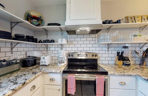 Bermuda Beach Cottage | Dog-friendly cottage with two primary suites, ocean views, beach access, & deck